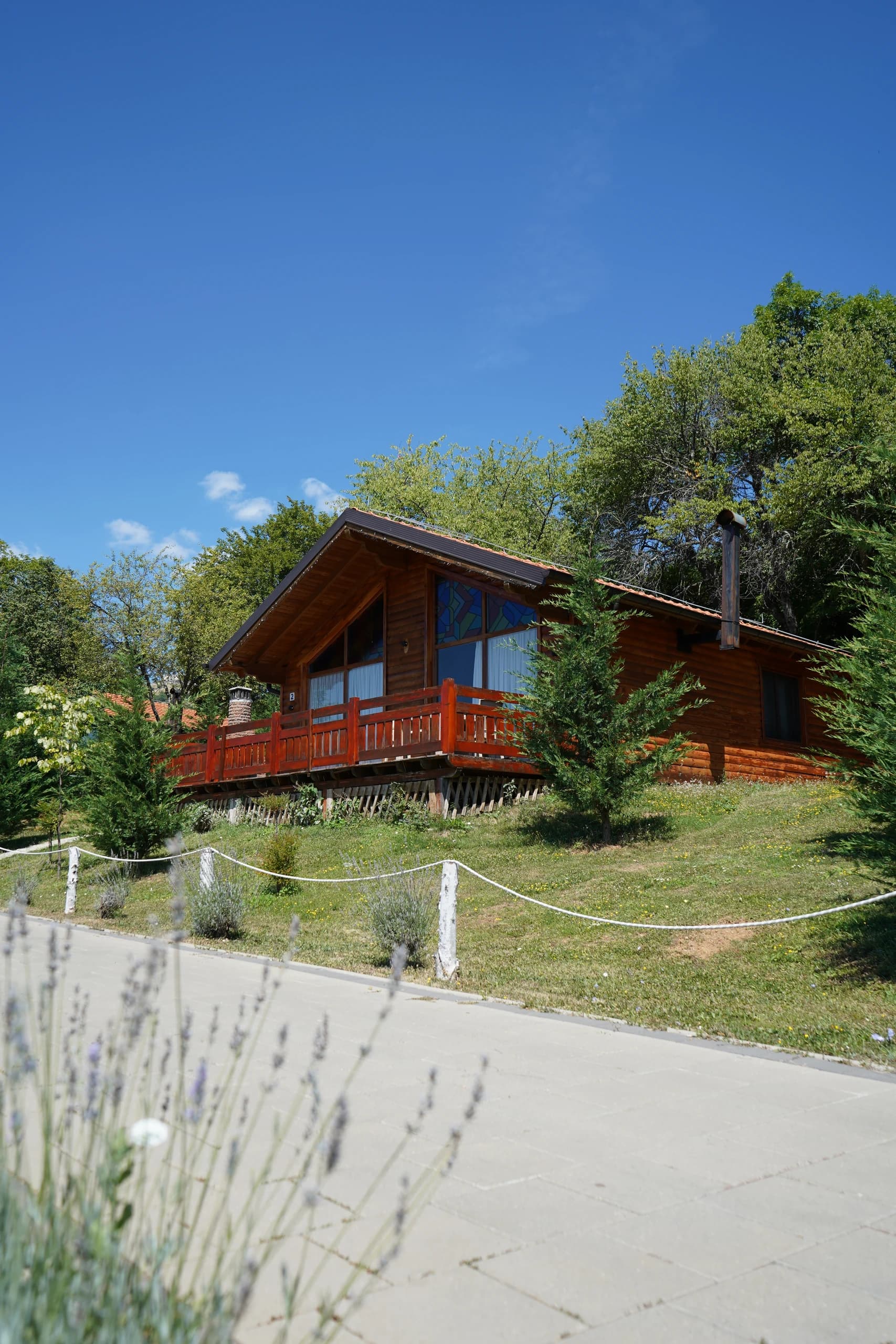 A villa beyond the lavender-lined path