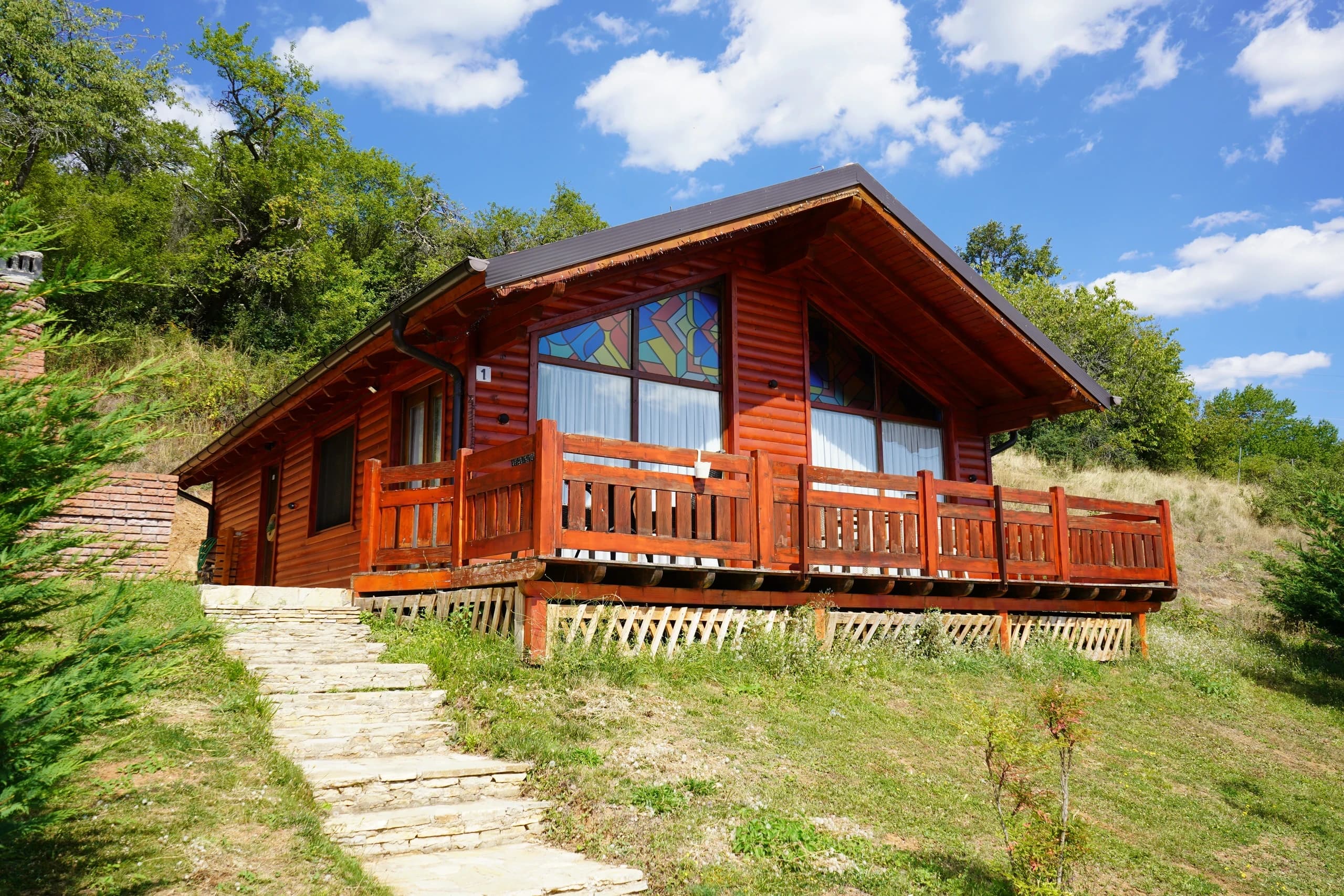 A timber villa from the lawn at BioLand